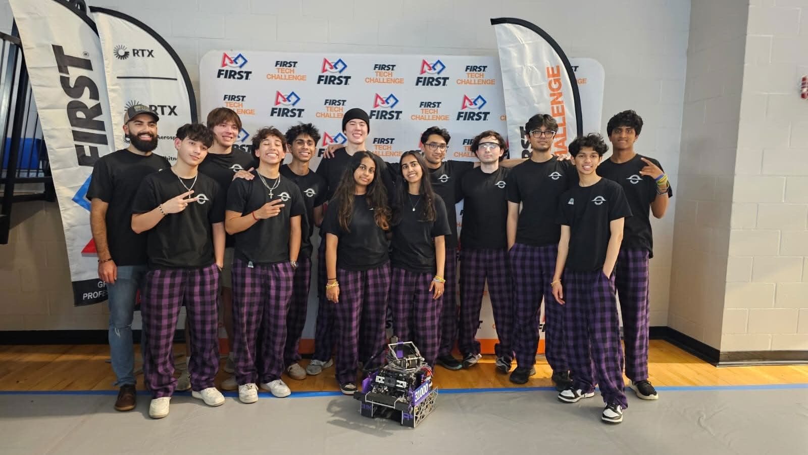 On the FIRST Tech Challenge field, robot in front.