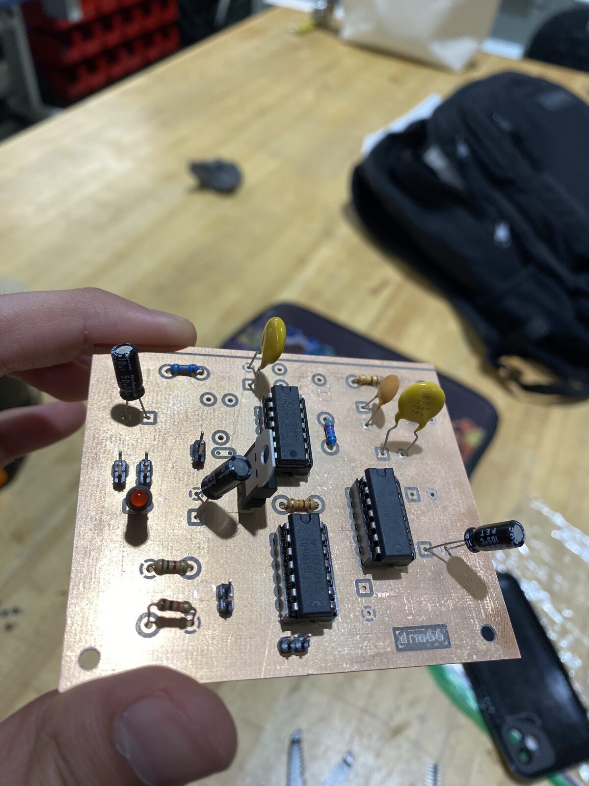 The populated board. Three DIPs, electrolytics, film caps — and drm66 in the silkscreen.