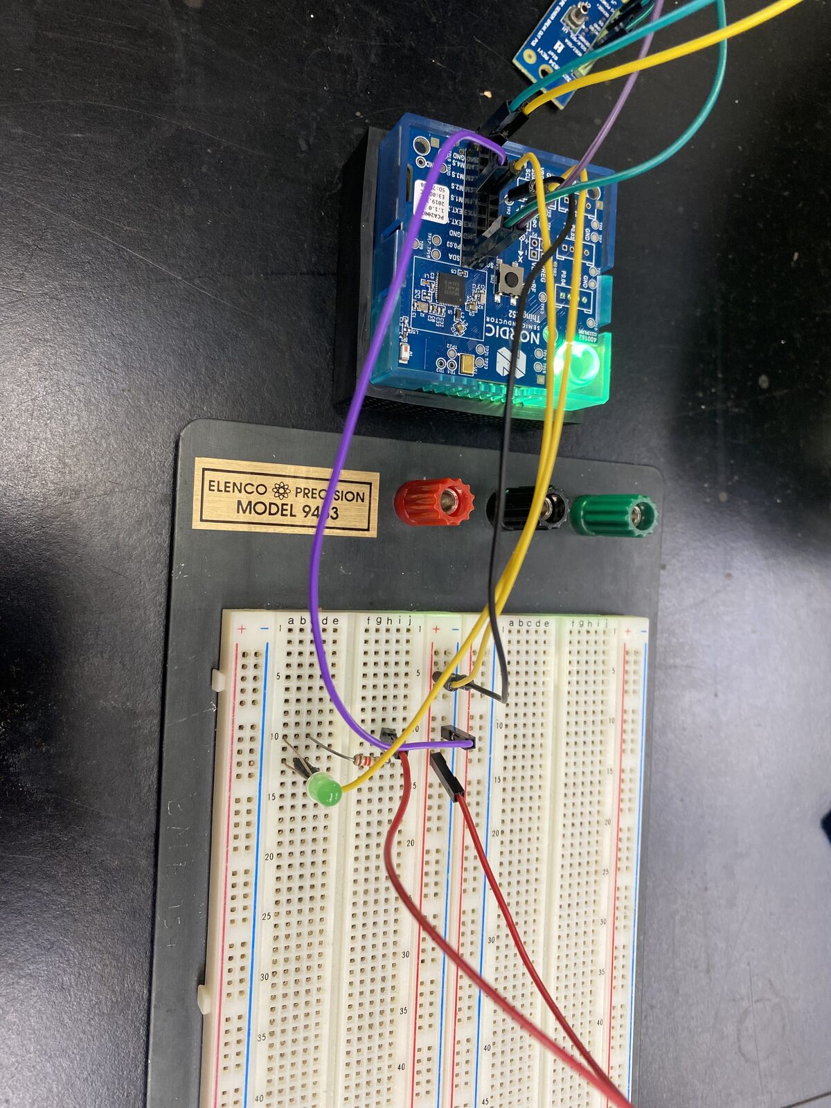 Bench setup — the development kit wired out to a breadboard.